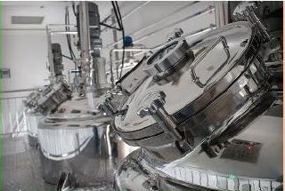 Automated capsule production equipment at a manufacturing partner facility